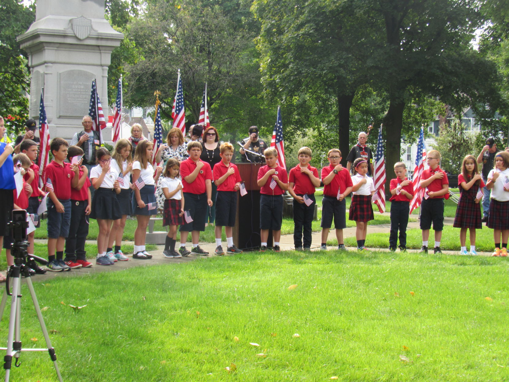 3rd and 4th graders say a prayer.